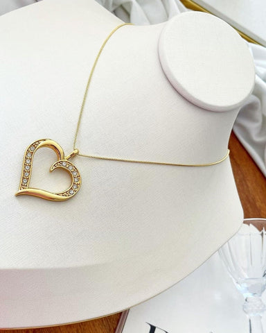 18k gold plated necklace with open heart and studded edge.