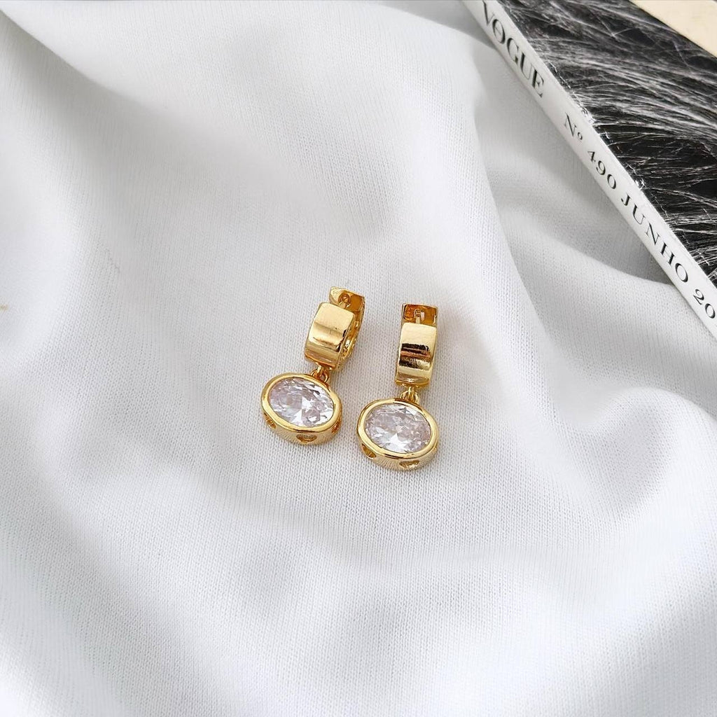 18k gold plated hoop with mini studded sphere.