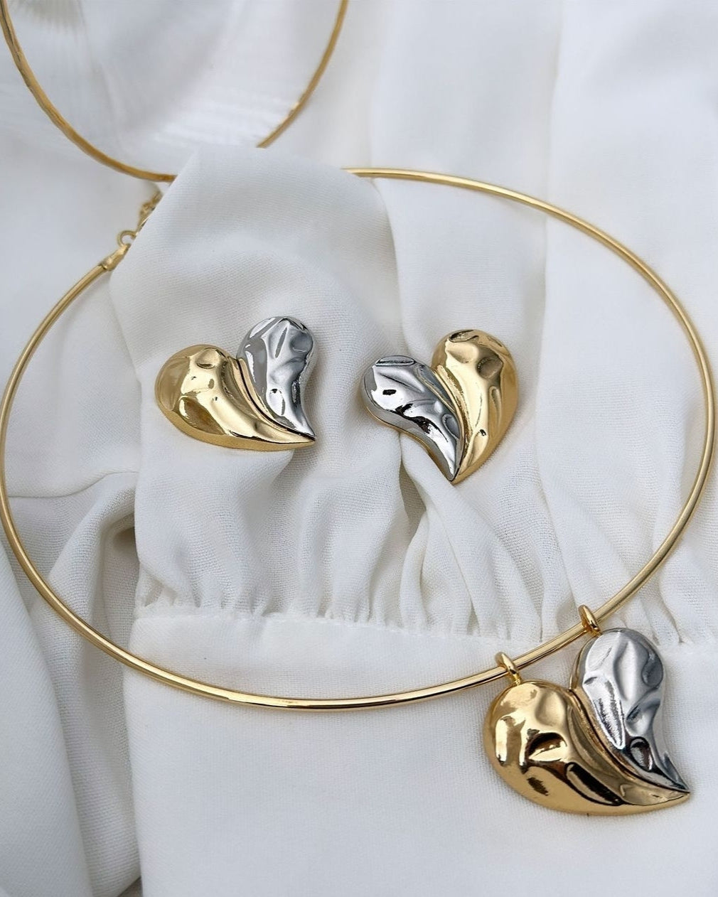 18k gold plated hoop set Mix of gold and silver plating with heart pendant.