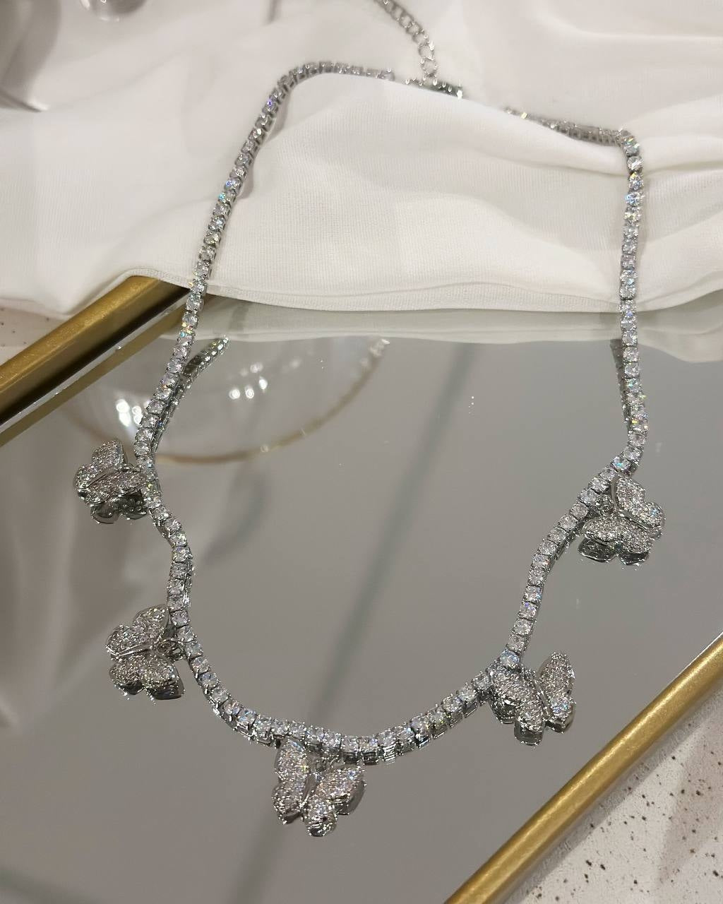 Silver plated butterfly necklace studded with zirconias.