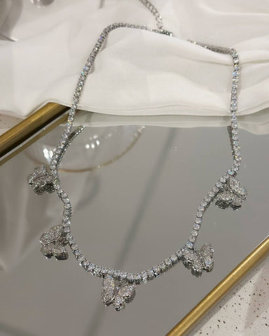 Silver plated butterfly necklace studded with zirconias.