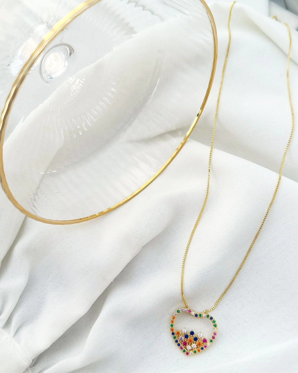 18k gold plated heart necklace studded with colored zirconias.
