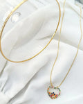 Colar Folheado a ouro 18k coração cravejado com zirconias coloridas.