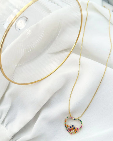 18k gold plated heart necklace studded with colored zirconias.