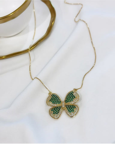 18k gold plated butterfly necklace studded with green zirconia.