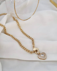 Necklace 18k gold plated and silver plated. Point of light studded with zirconias.