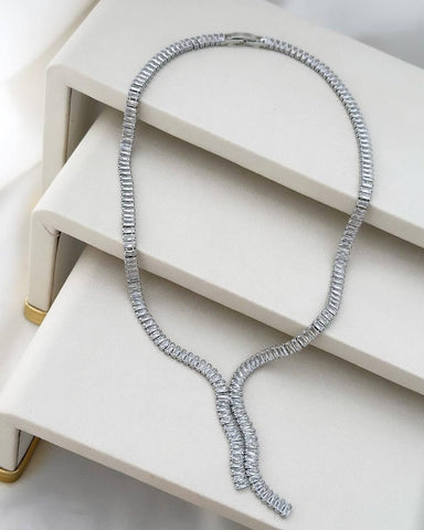 Silver plated necklace with chain and studded with a point of light.