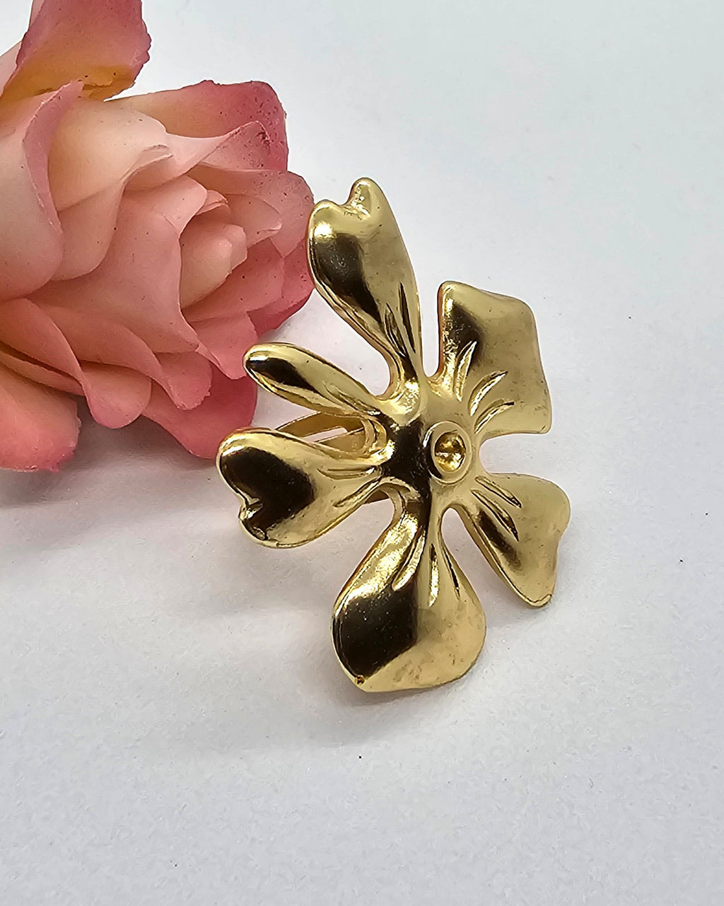 Gold plated ring with adjustable detailed flower.