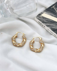 Brinco Argola click Folheado a ouro 18k Cravejado.