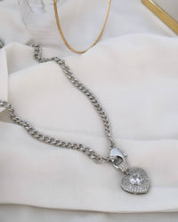 Necklace 18k gold plated and silver plated. Point of light studded with zirconias.