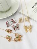 Conjunto Borboleta cravejado com zirconias coloridas folheado a prata e folheado a ouro 18k .