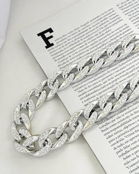 Colar e pulseira elos grandes cravejado dourado e prata.