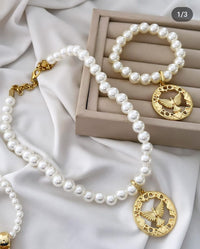 Colar e pulseira Folheado a ouro 18k Pérola e Espírito Santo .