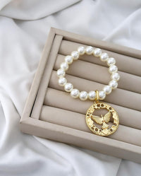Colar e pulseira Folheado a ouro 18k Pérola e Espírito Santo .