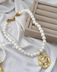 Colar e pulseira Folheado a ouro 18k Pérola e Espírito Santo .