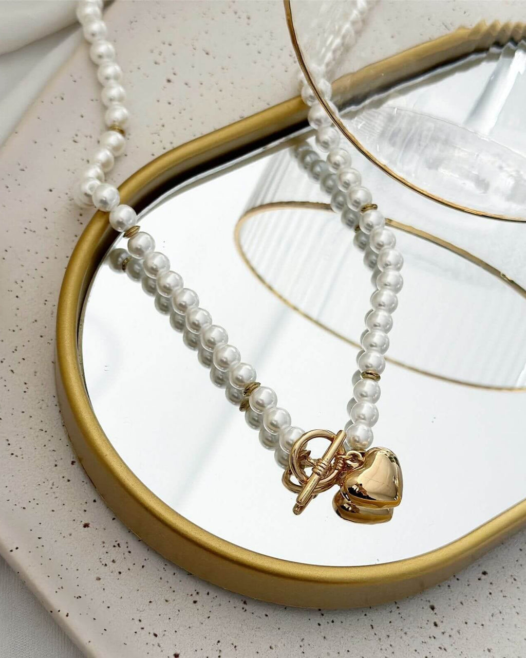Colar Folheado a ouro 18k e folheado a prata Pérola e coração.
