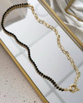 Riviera Folheado a ouro 18k duo  Cravejado com zirconias preta com fecho boia.