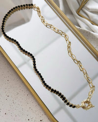 Riviera Folheado a ouro 18k duo  Cravejado com zirconias preta com fecho boia.