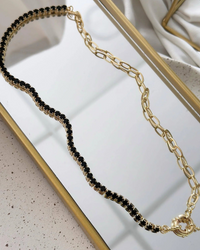 Riviera Folheado a ouro 18k duo  Cravejado com zirconias preta com fecho boia.